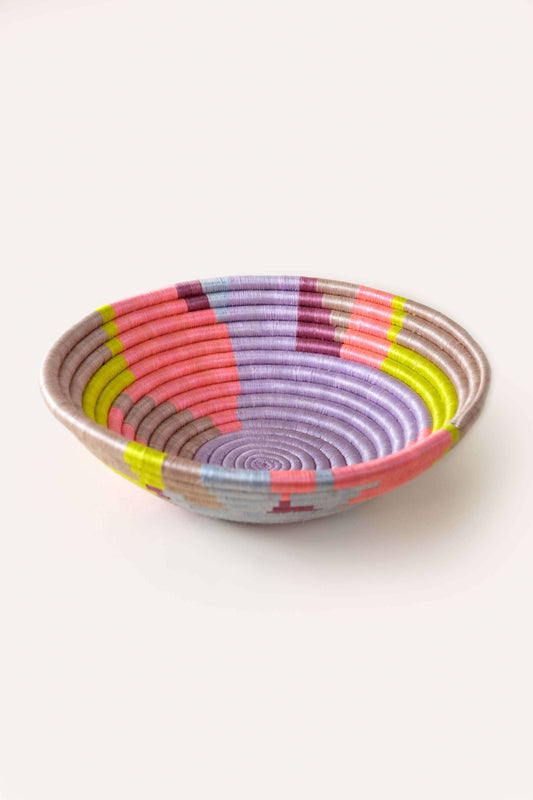Colorful woven bowl on a white background