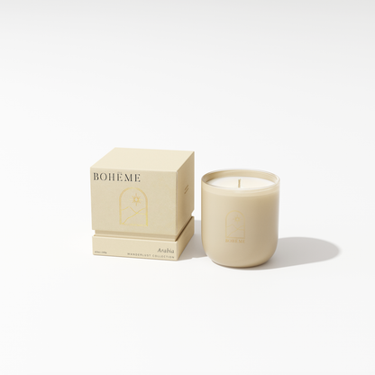 Beige candle with matching packaging on a white background