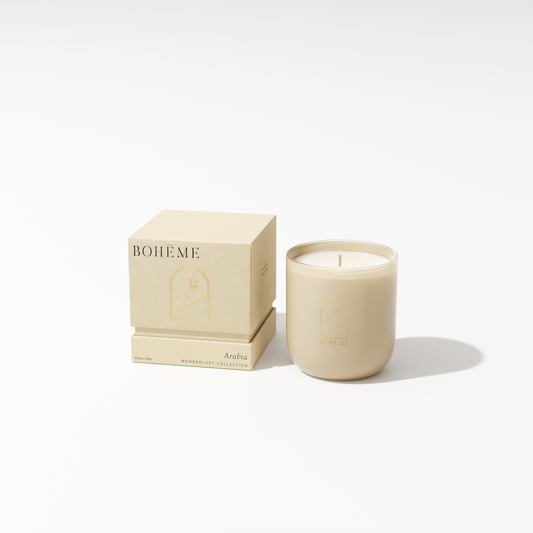 Beige candle with matching packaging on a white background
