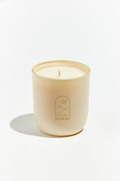 Candle in a glass jar with 'Boheme' branding on a white background