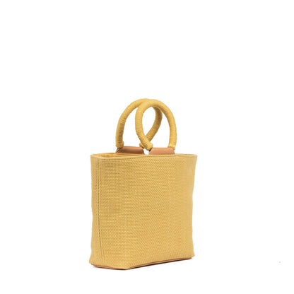 Yellow woven handbag with circular handles on a white background
