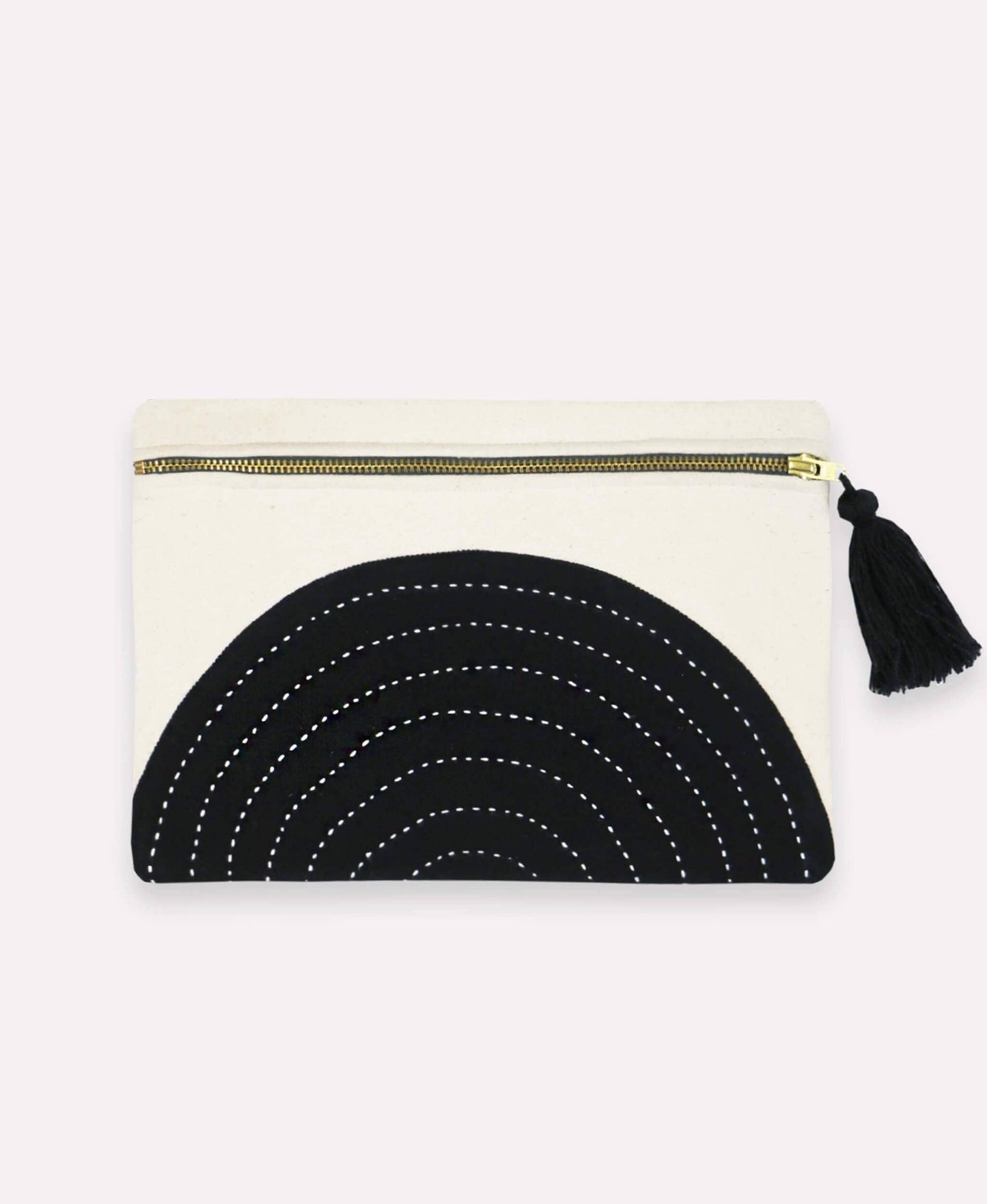 Black and white pouch with tassel on a white background