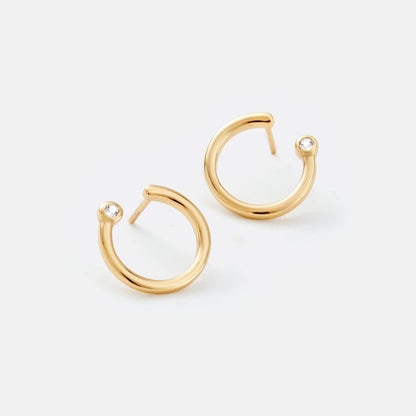 Gold hoop earrings on a white background
