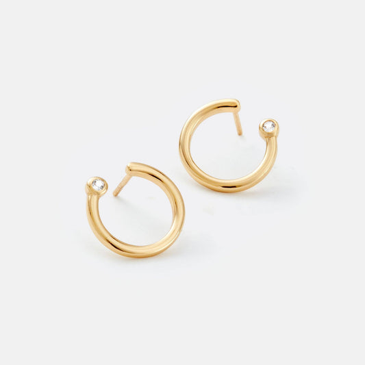 Gold hoop earrings on a white background