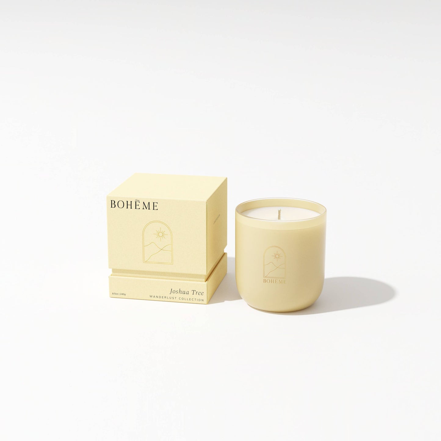 Beige candle with 'Bohème' packaging on a white background
