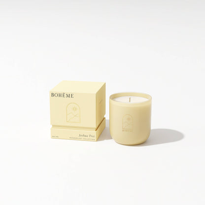 Beige candle with 'Bohème' packaging on a white background