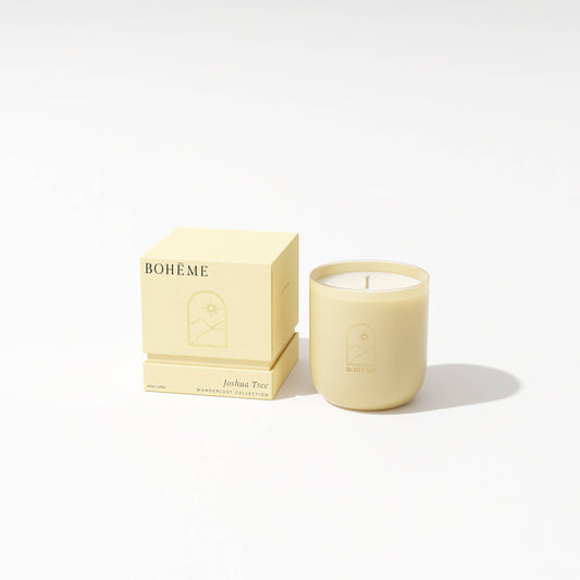 Beige candle with 'Bohème' packaging on a white background