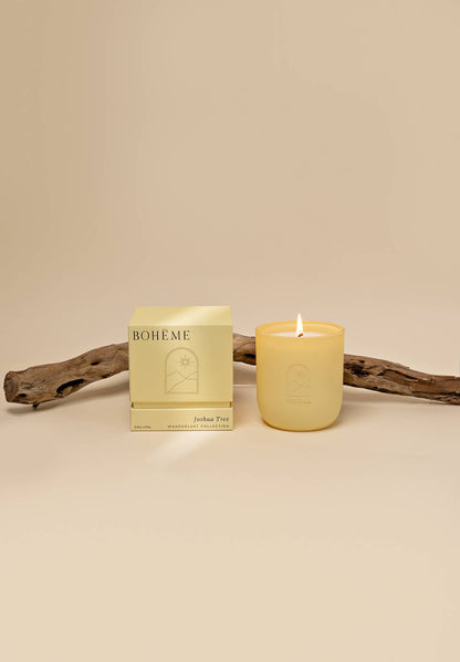Candle and packaging with 'BOHE.ME' branding on a beige background