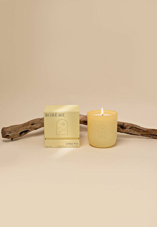 Candle and packaging with 'BOHE.ME' branding on a beige background