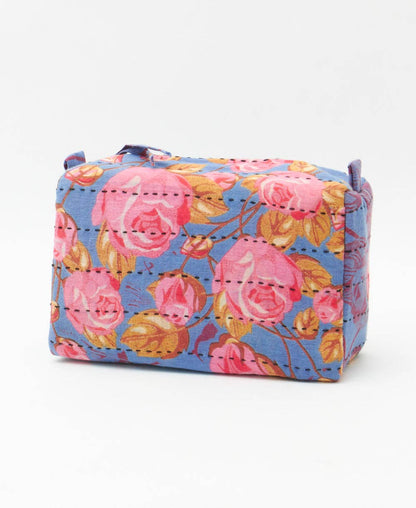 Floral-patterned box with pink roses on a blue background