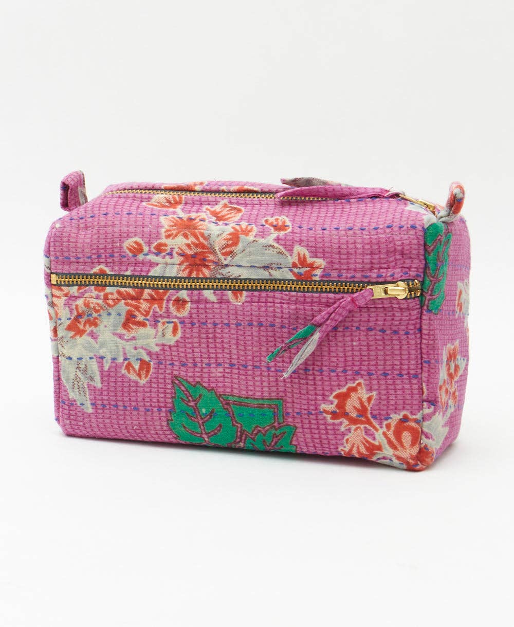 Pink floral-patterned bag on a white background