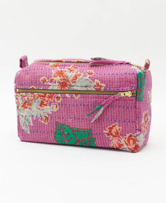 Pink floral-patterned bag on a white background