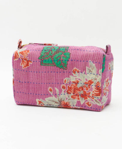 Pink floral-patterned pouch on a white background