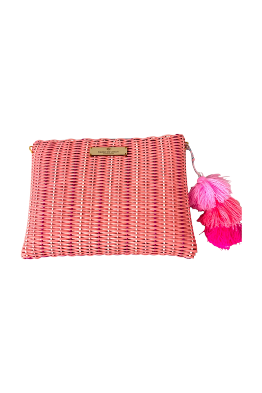 Pink woven clutch bag with tassels on a white background