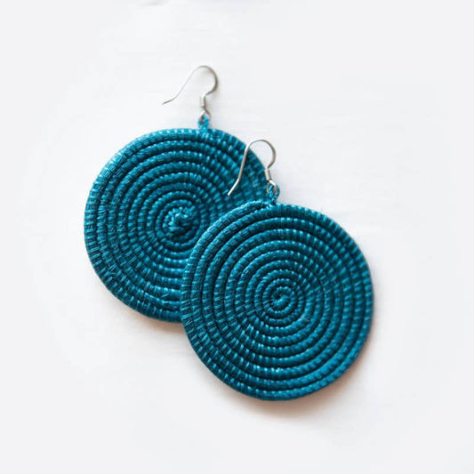Pair of blue spiral earrings on a white background