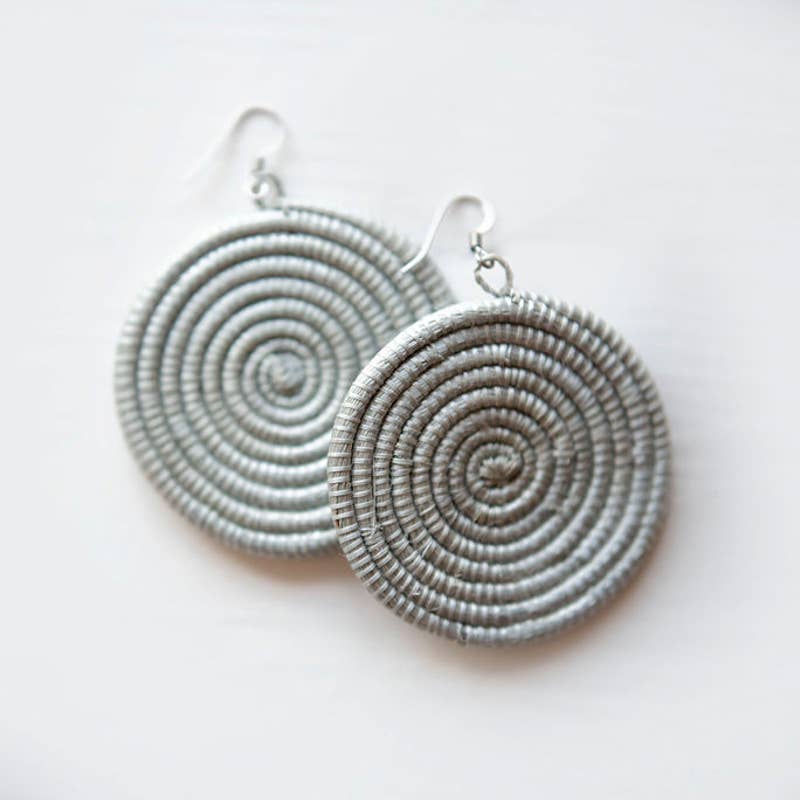 Pair of silver spiral earrings on a white background