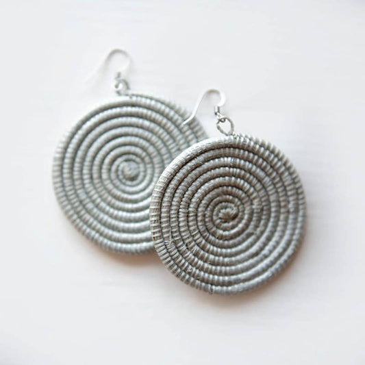Pair of silver spiral earrings on a white background