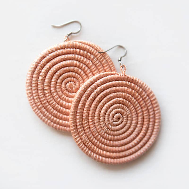 Pair of spiral-patterned earrings on a light background