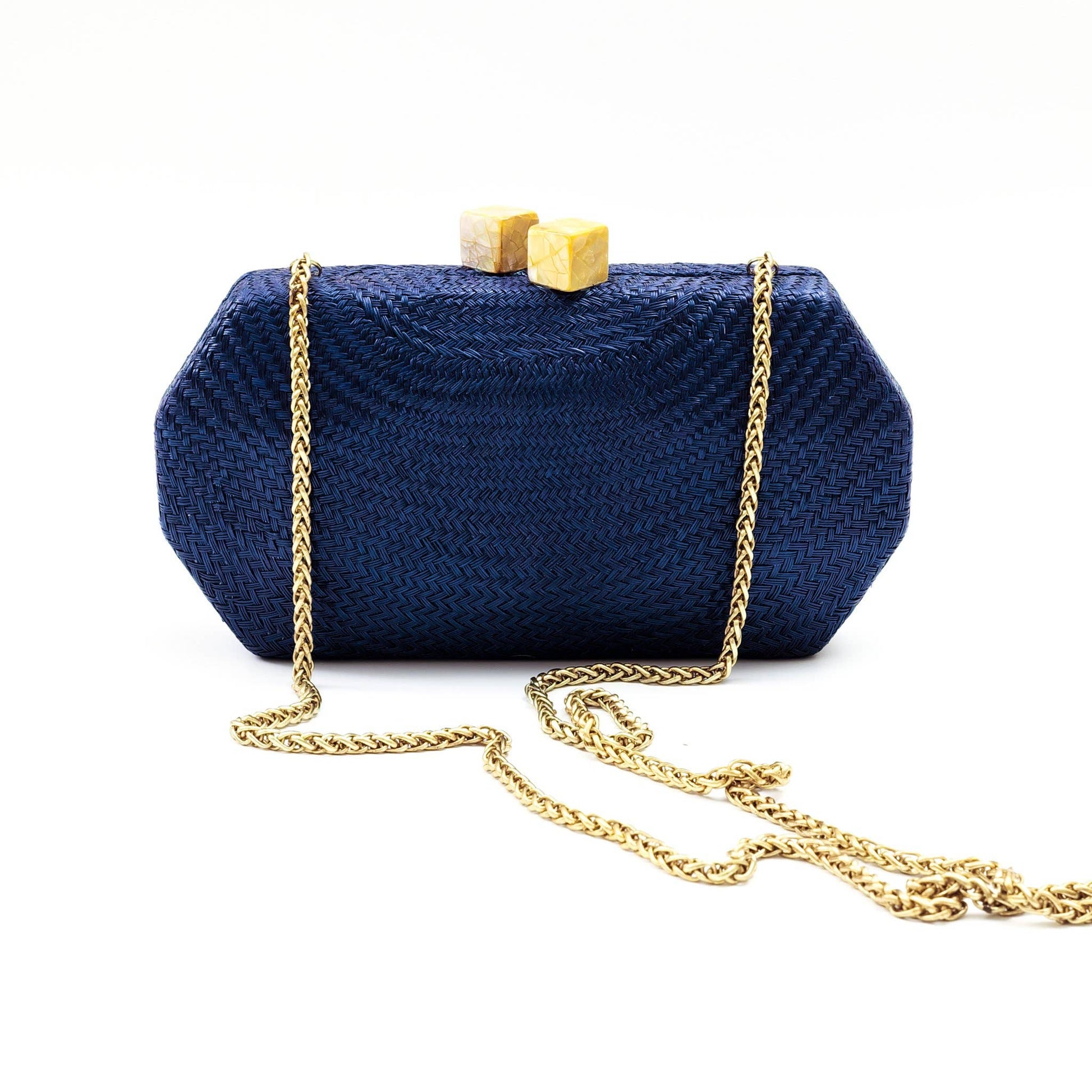 Navy blue clutch bag with gold chain on a white background