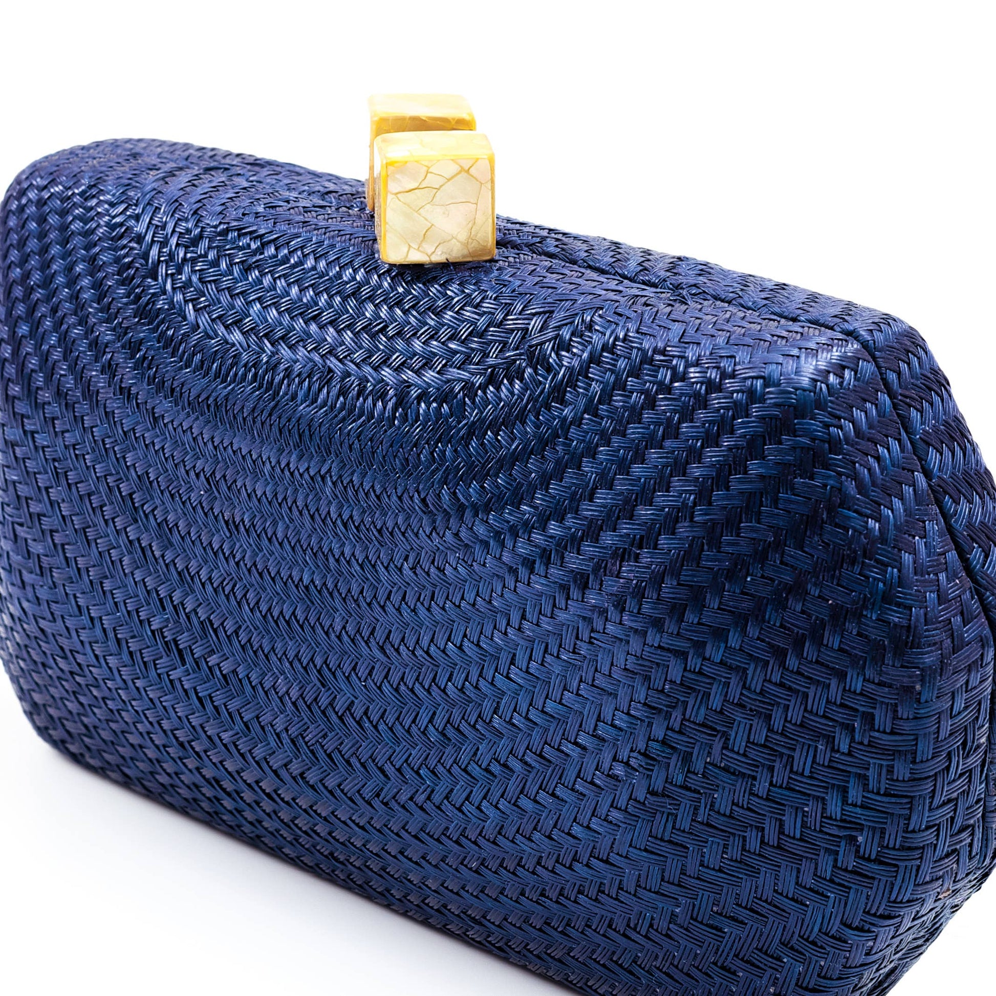 Blue woven clutch bag with a gold clasp on a white background