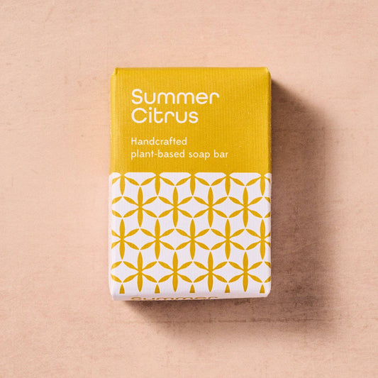 Handcrafted plant-based soap bar packaging with 'Summer Citrus' text on a beige background