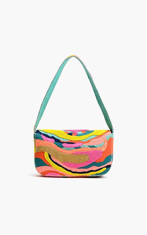Multicolored handbag with a green strap on a white background