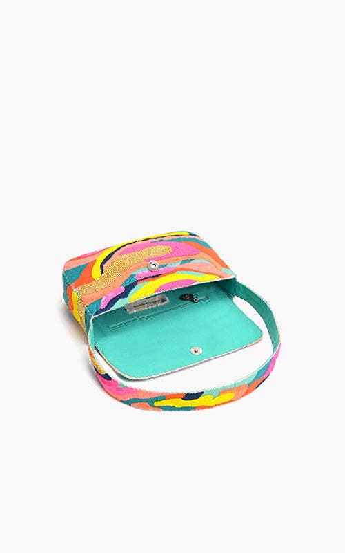 Colorful handbag with a turquoise interior on a white background