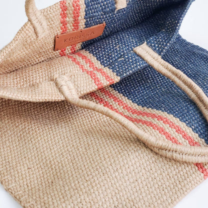 Textured fabric bag with a visible brand label on a white background