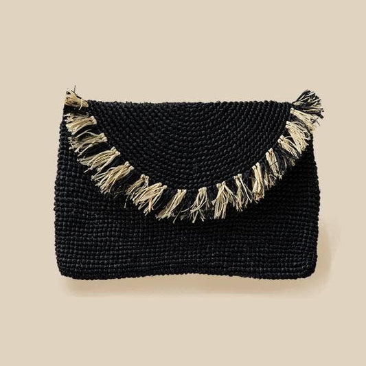 Black woven clutch with tassels on a beige background