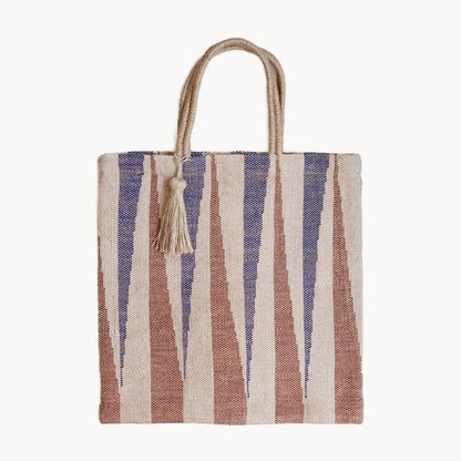 Striped tote bag with a tassel on a white background