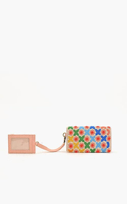 Floral patterned wallet with a matching cardholder on a white background
