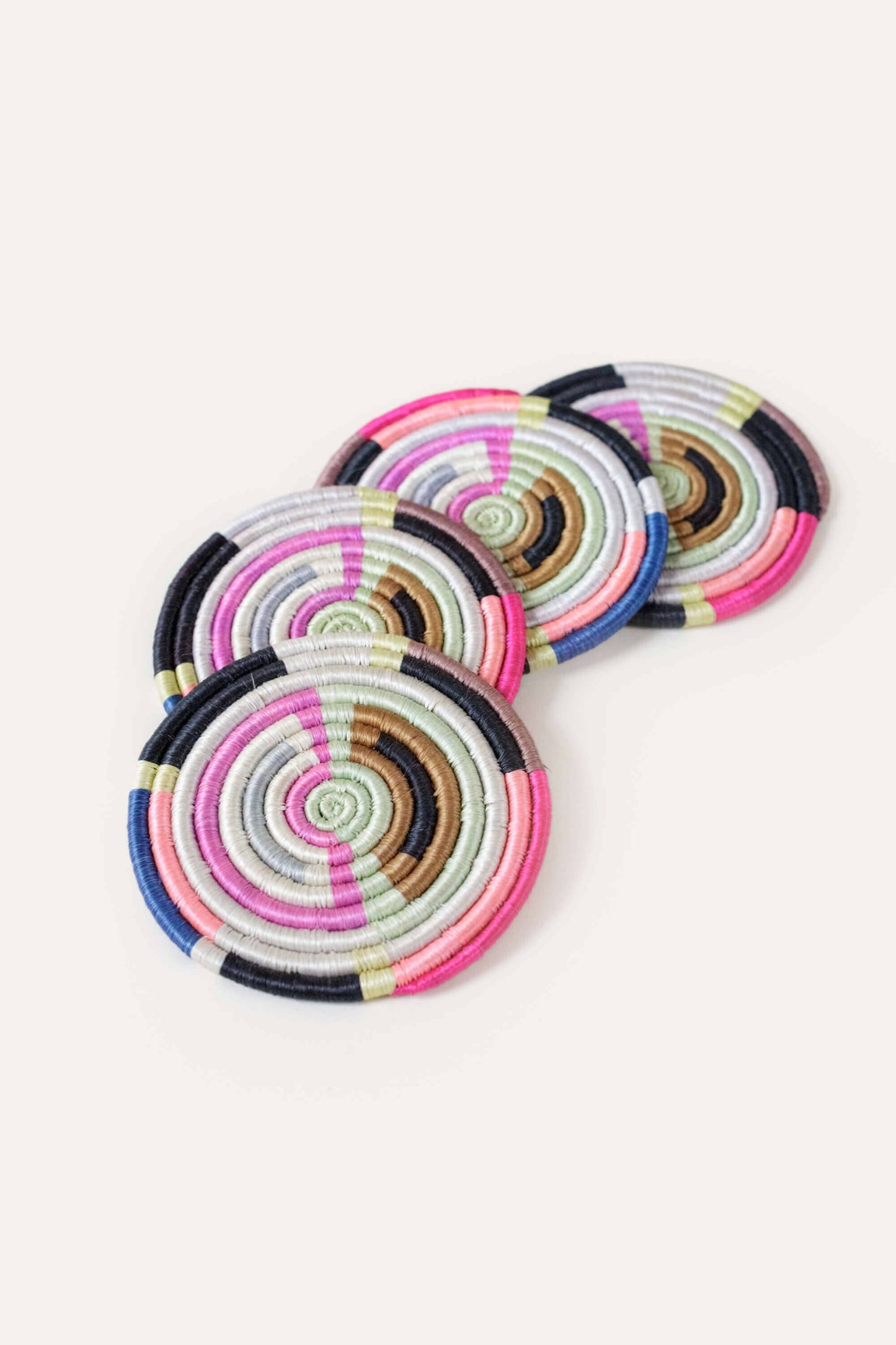 Set of colorful circular coasters on a white background