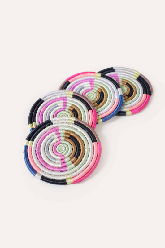 Set of colorful circular coasters on a white background