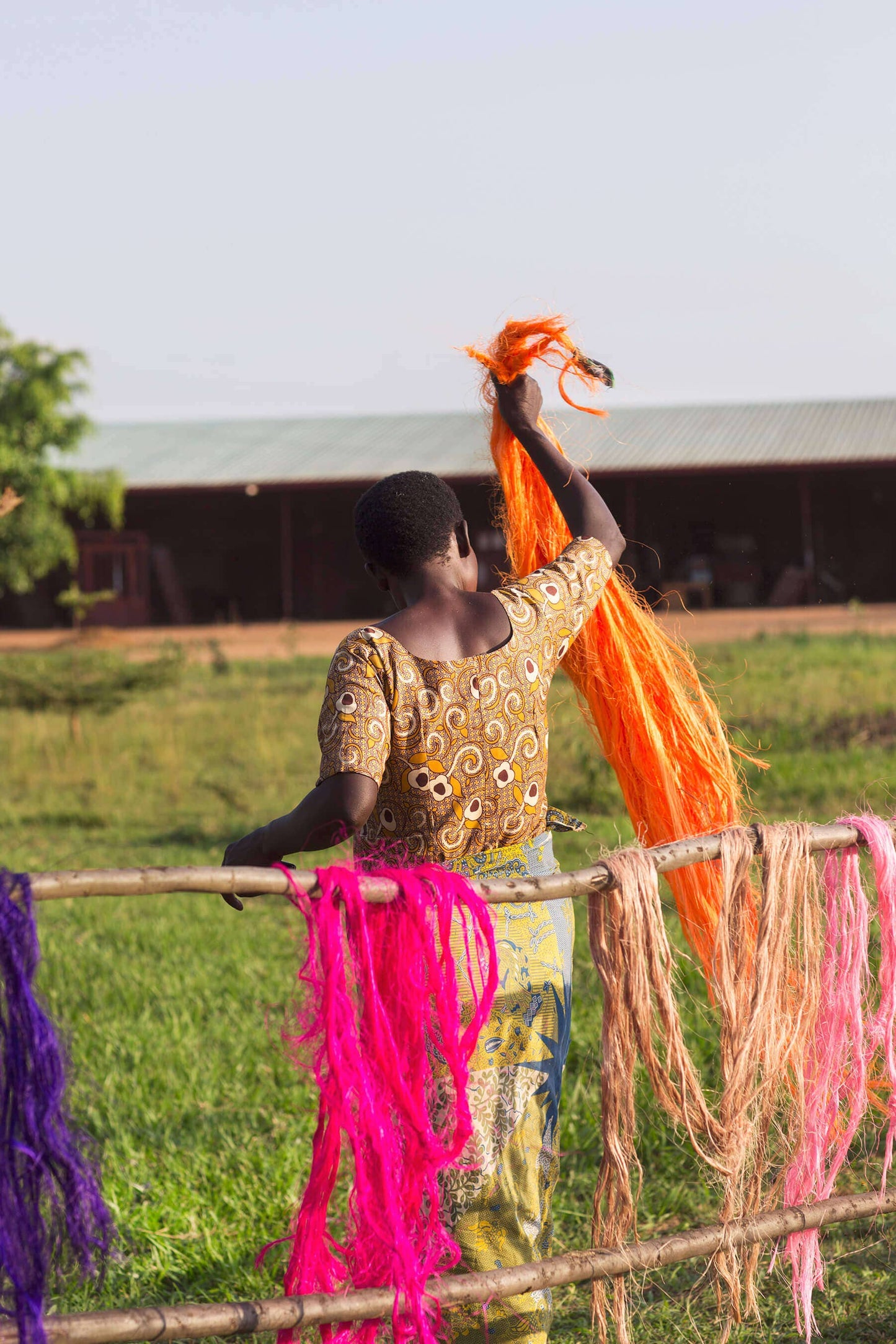 Woman working with colorful yarn in an outdoor setting