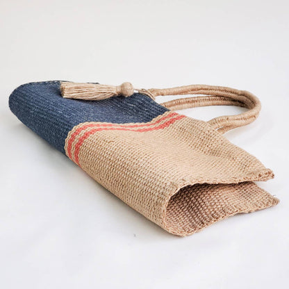 Jute bag with denim top section on a white background
