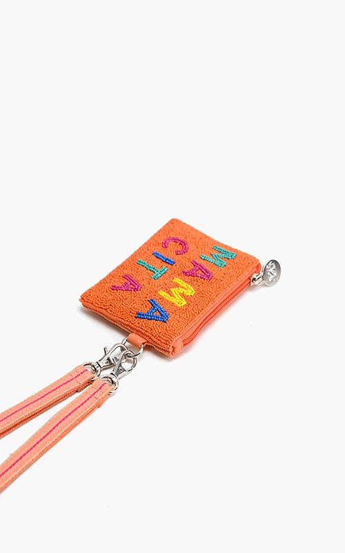 Orange cardholder with colorful letters on a white background