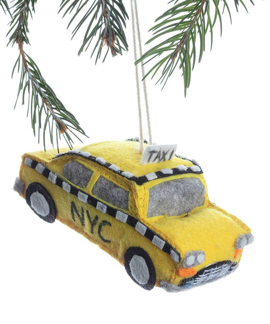 Yellow taxi cab ornament with 'NYC' on a white background