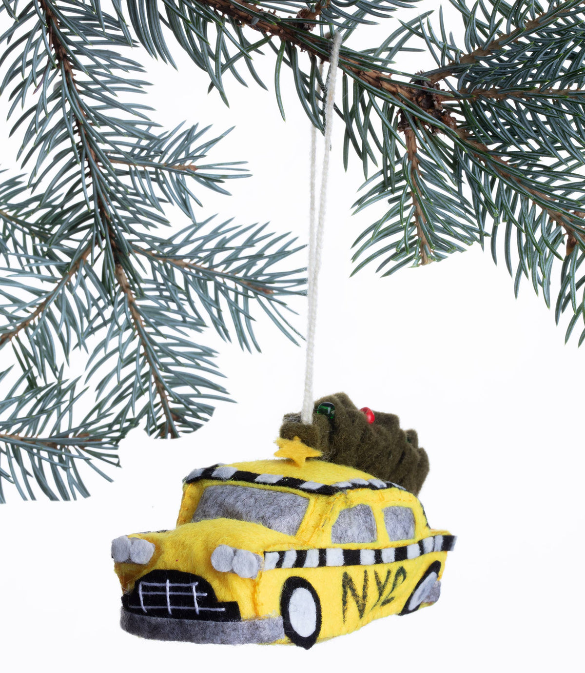 Yellow taxi-shaped ornament hanging on a Christmas tree branch