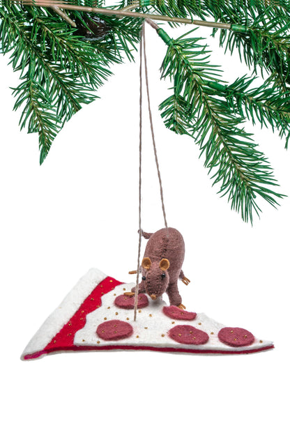 Christmas ornament of a rat on a pizza slice with pine branch background