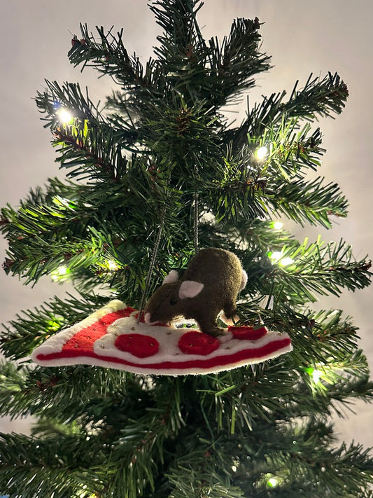 Christmas tree ornament with a rat on a pizza slice, hanging from a tree.