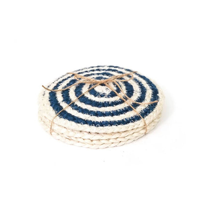Round woven coaster with blue and white pattern on a white background