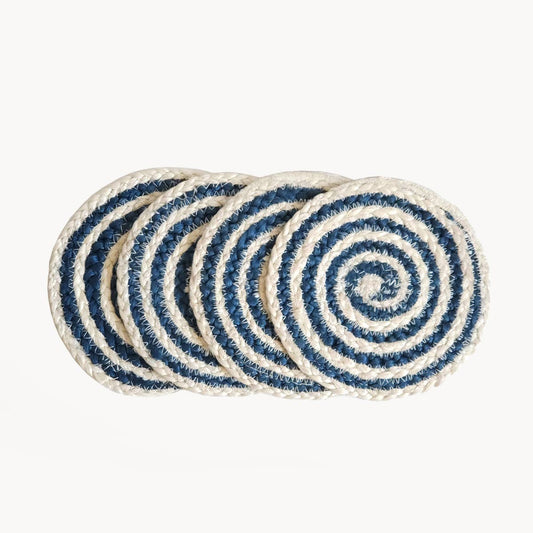 Set of four blue and white striped coasters on a white background
