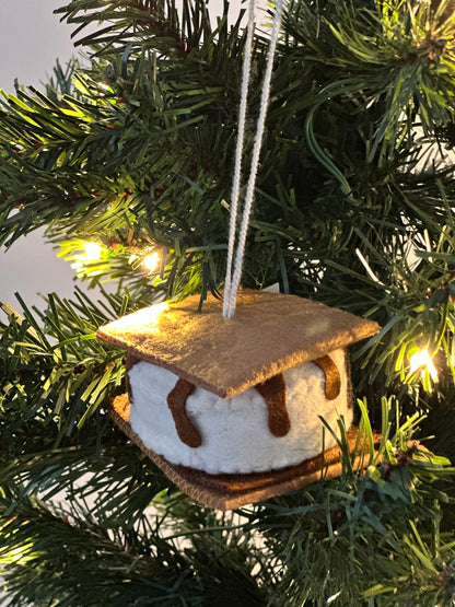 S'mores ornament hanging on a Christmas tree