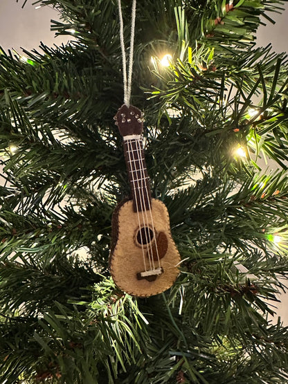 Guitar-shaped ornament hanging on a Christmas tree