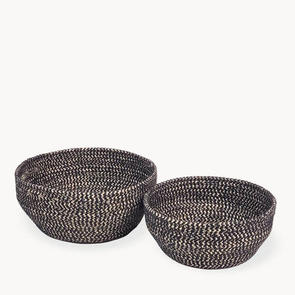 Two woven baskets on a white background