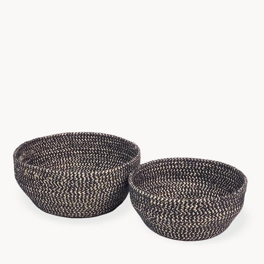 Two woven baskets on a white background
