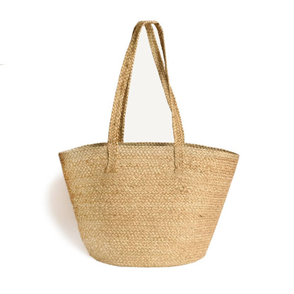 Woven straw tote bag on a white background